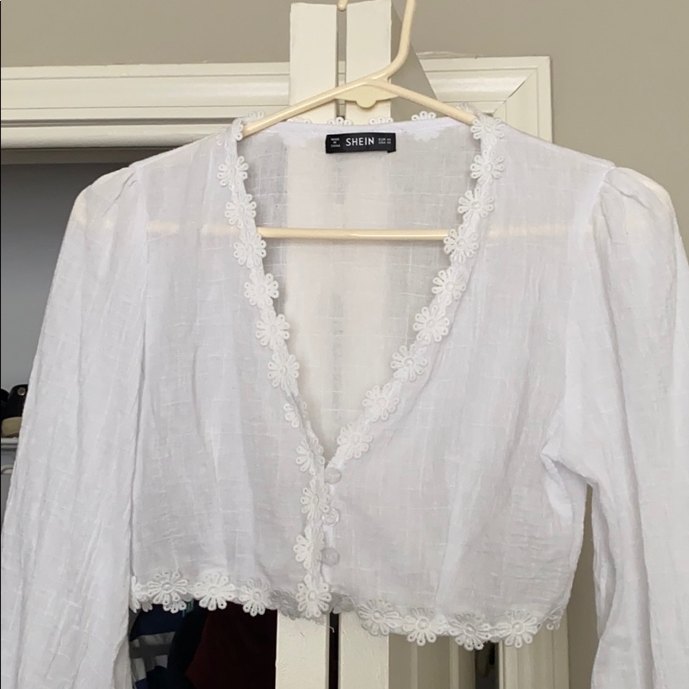 White blouse with flower details